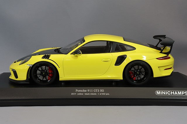 MINICHAMPS MC155068231 1/18 Porsche 911 GT3 RS 2019 in Yellow, side view on display base