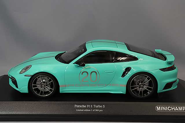MINICHAMPS MC155069175 1/18 Porsche 911 Turbo S 2021 in Green, side view on display base